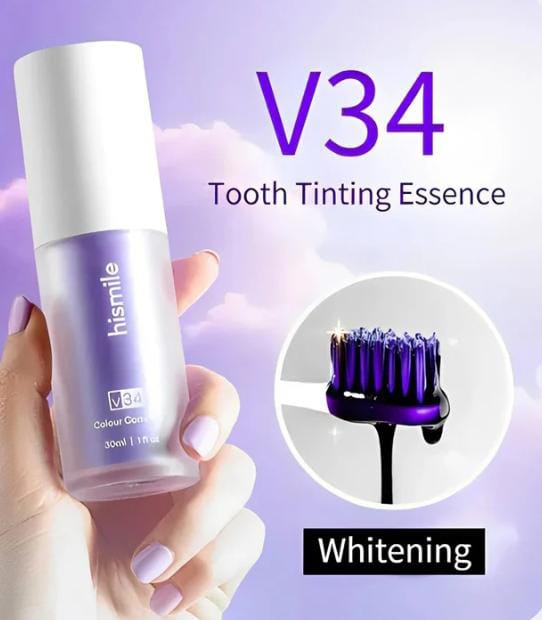 Bottle of V34 Tooth Tinting Essence held by a hand with a purple background
